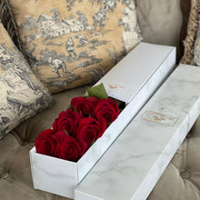 Close-up of 6 red roses with delicate layers of petals from Vancouver's Box Des Fleurs. An exquisite gift to add elegance and beauty to any space. Order now for fresh, handcrafted flowers from Vancouver's premier florist.